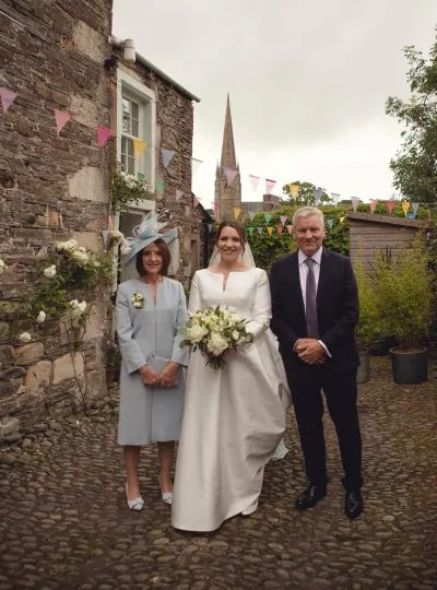 Jane and her parents on her wedding day